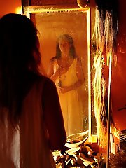 An amazing old lady is posing almost naked in stunning shots