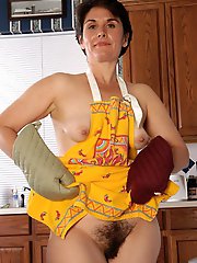 An aged prostitute is spreading her legs to make some money