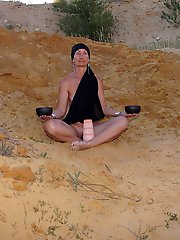 On sand seminude with light-color vase