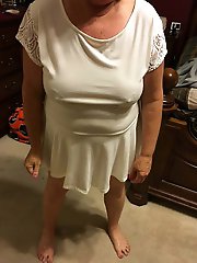 Experienced dame is taking off her underwear