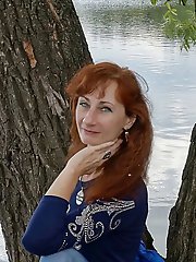 A beautiful mature woman is fondling her genital area