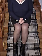 A blonde beauty enjoys wearing nylon stockings.