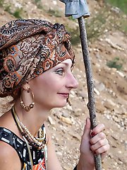 With spear wearing in colorful dress